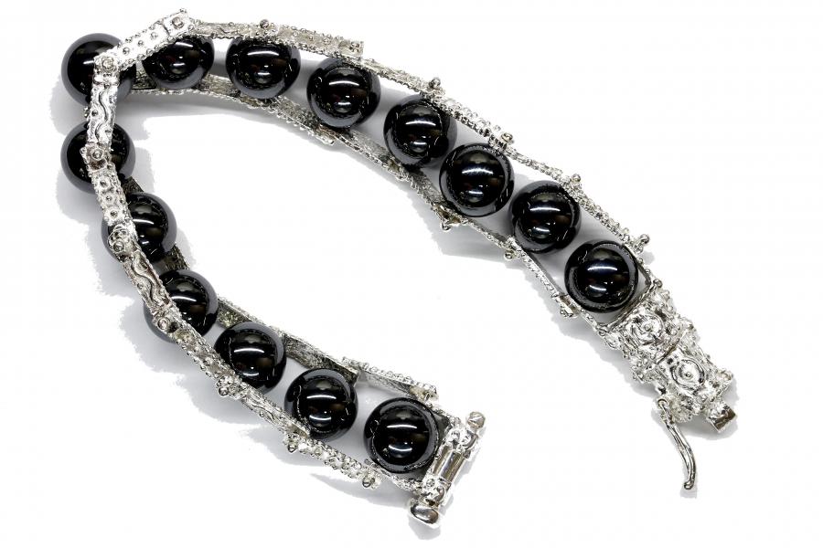 Bracciale in oro zaffiri, smeraldi e rubini